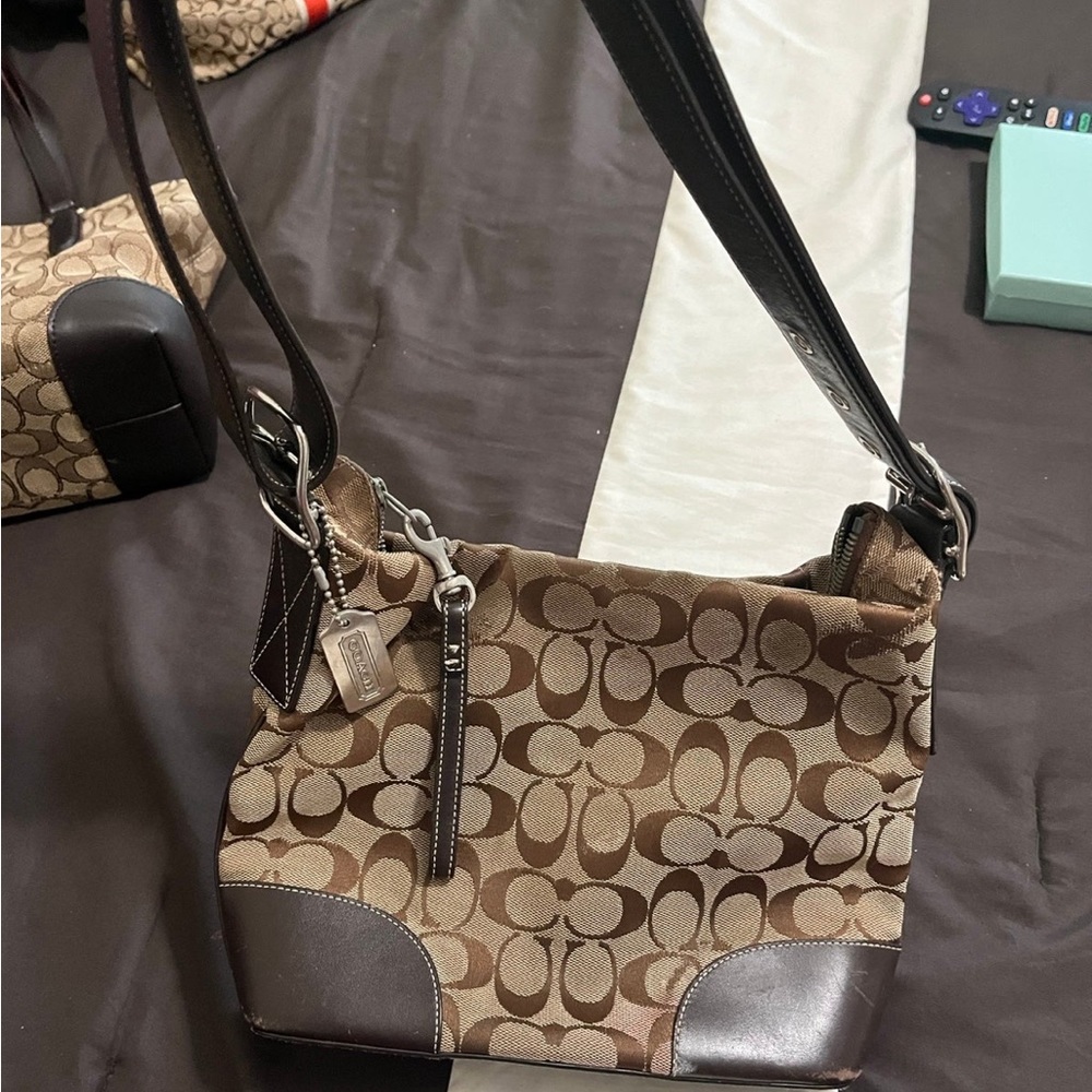 Coach purse, used. Has some scratches (shown in pictures) brown/tan color